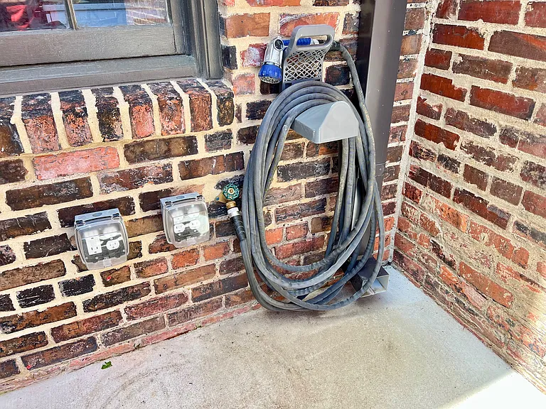 Electrical outlets and hose bib.