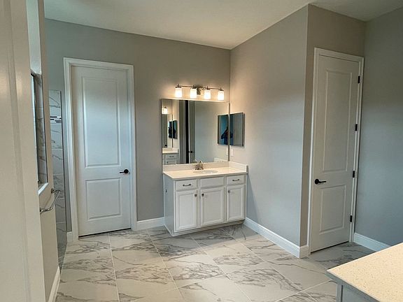 Sweet bay new construction quick move-in home plan owner s bathroom at Cross Creek by William Ryan H