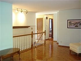 Gleaming hardwood floors are found in the entryway, kitchen, living room, sunroom and hallway and ar