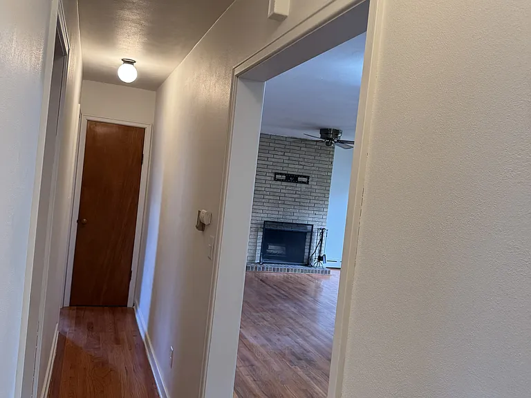 Hallway to bedrooms and bath. Linen closet at the end of the hall.