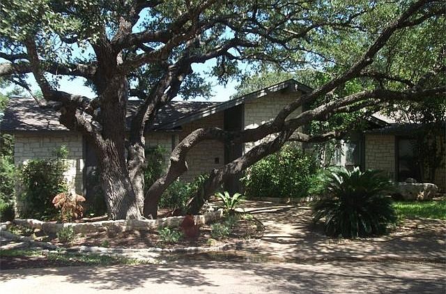 Large Oaks Surround The Home