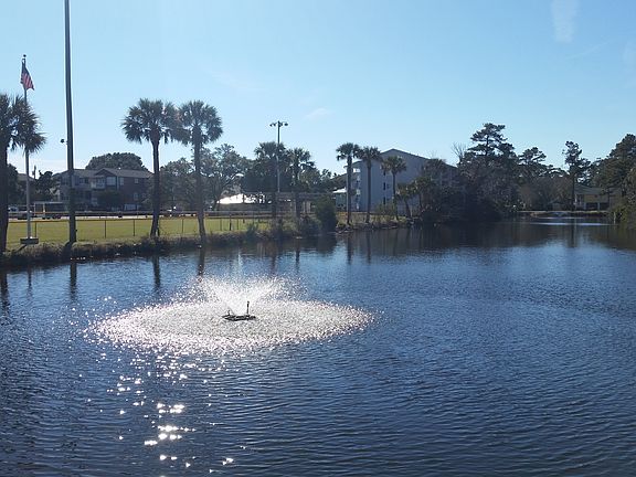 Side & rear overlooking lake