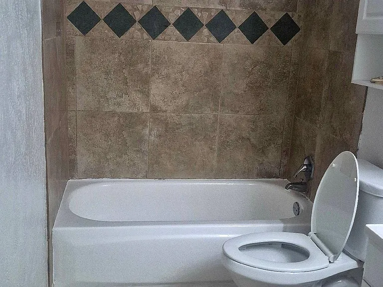 Bathroom with tub and shower