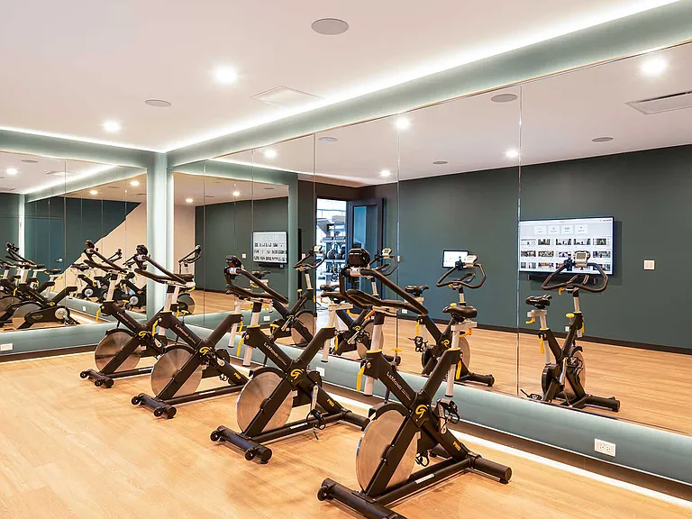 Elevate your endurance in the dedicated spin studio, featuring high-performance bikes, mirrored walls, and on-screen workouts for every pace and playlist.