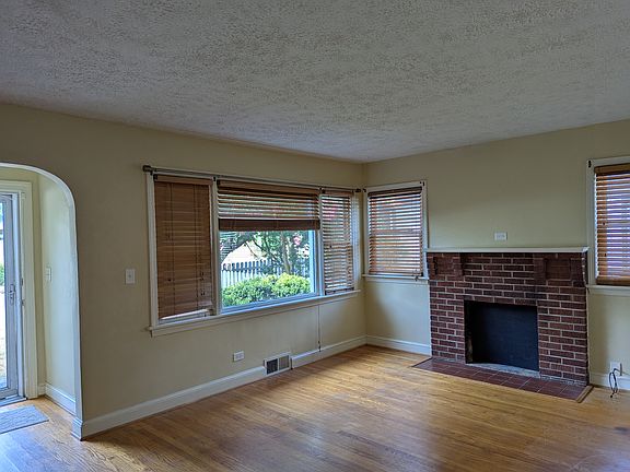 living room with closed fireplace