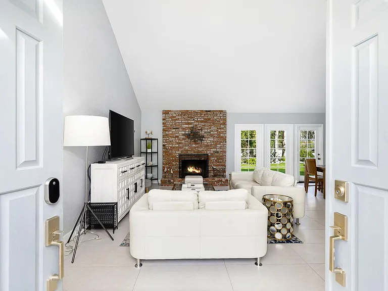 Walking into living area through double doors.