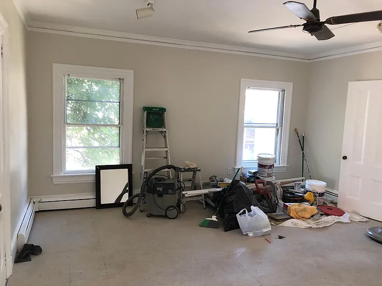 Plenty of windows and closets on both sides in this enormous living room!