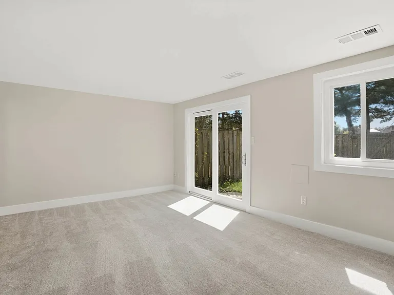 Family room w/ new carpet, fresh paint & new trim
