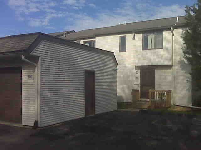Front entrance with view of garage