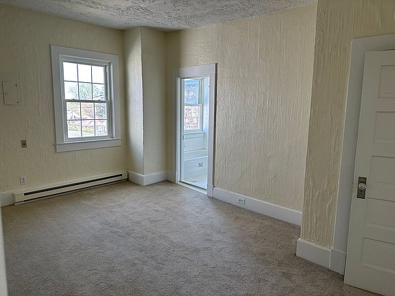 Large bedroom with closet and bathroom.