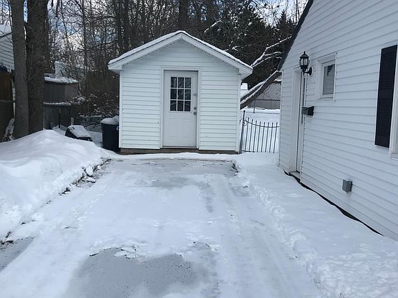 Large unheatef utility shed does include electricity with two windows for ventilation and window boxes for flowers . Great place to store the gas grill and for a patio furniture .