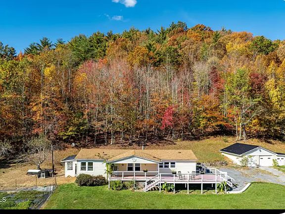 Stunning views, surrounded by natural forest and wrap around porch, rocking the cares away while soaking up some sun after a busy days work!