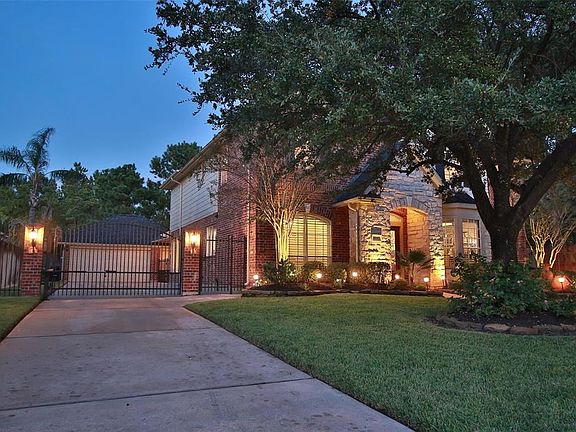 Extended driveway to gate and service entry for extra play space for children or pets.