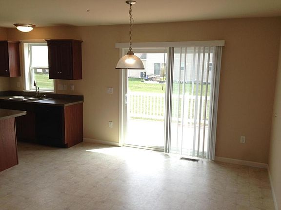 Eating area adjacent to kitchen. Well lit from morning sunlight.