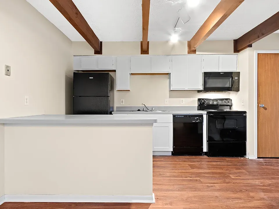 This home features a modern kitchen with updated appliances such as oven, stove, dishwasher and fridge.