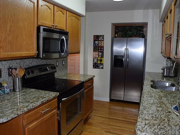 Kitchen with stainless appliances and granite counters