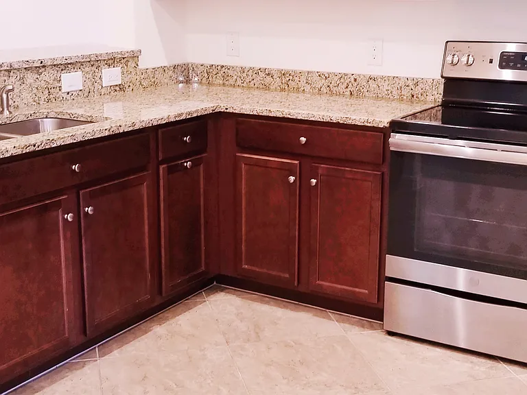 Gourmet Kitchen. Stainless Steel kitchen appliances. Granite Top. Beautiful mahogany style cabinetry.