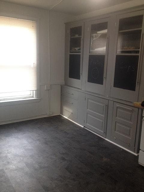 large kitchen with original restored cabinets, unique chalk