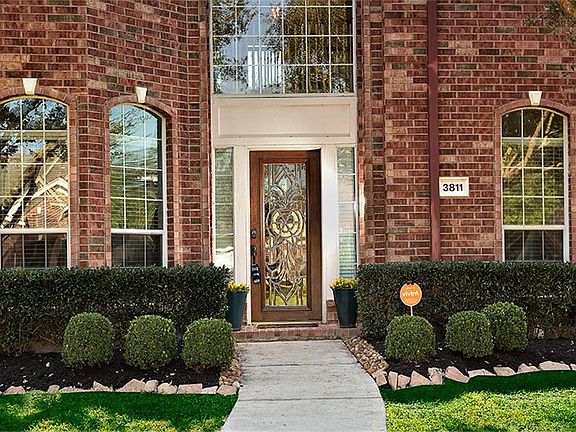 Tall windows allow unlimited viewing focusing on the beautiful backyard; everything is conveniently designed for ease of living.