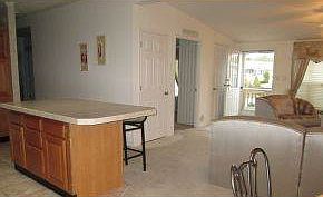 Den to the left of front door