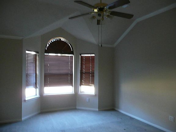 MASTER BEDROOM BAY WINDOW WITH WOOD BLINDS