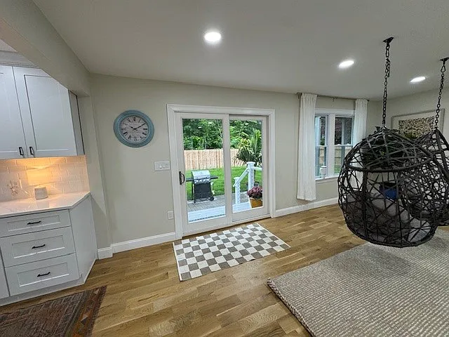 Sliding doors in the back to deck and closed in back yard.