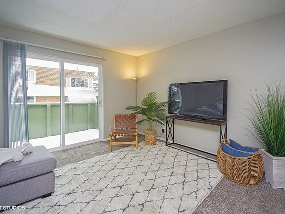 Large living space with attached balcony