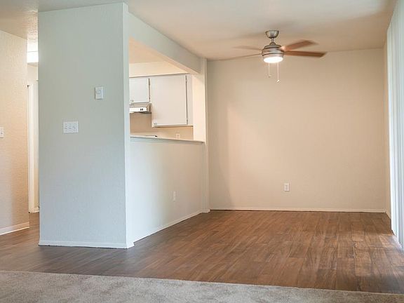 Apartment homes at Sunset Gardens include a full sized washer and dryer, ceiling fan, walk-in closet, living room with wood burning tiled fireplace and bay window. Exact features, flooring, colors, and dimensions vary from one apartment to another and may