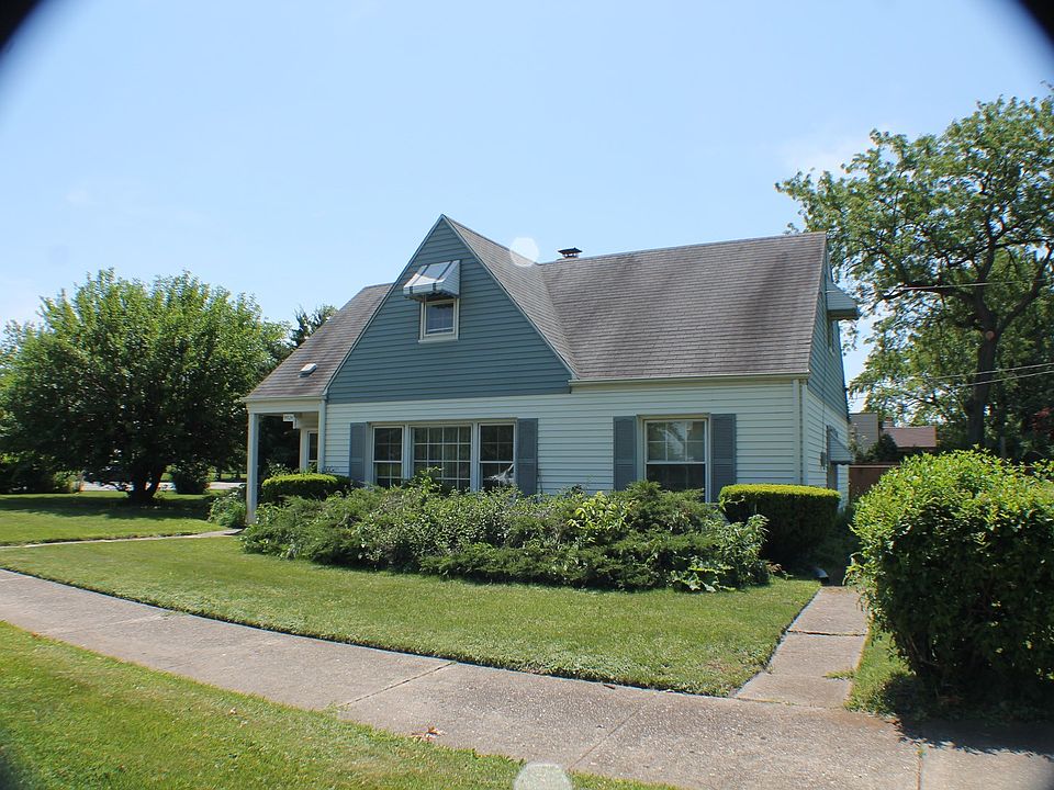 Adorable cape cod with mature landscaping and lots of curb appeal!