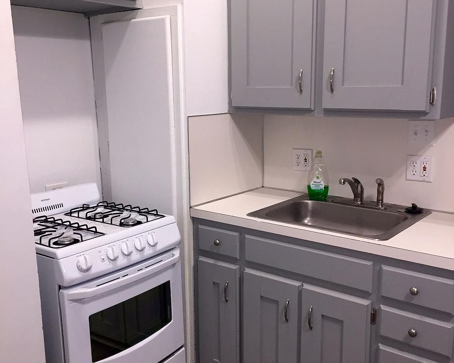 New gas-top range, faucet and cabinet hardware.