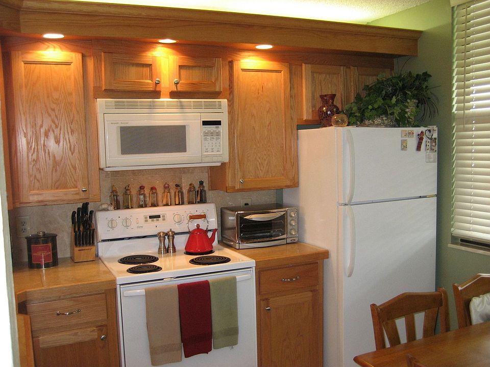 Remodeled eat in kitchen with golden oak cabinets