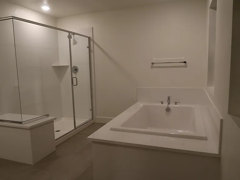 Master bath with shower stall and spa bath