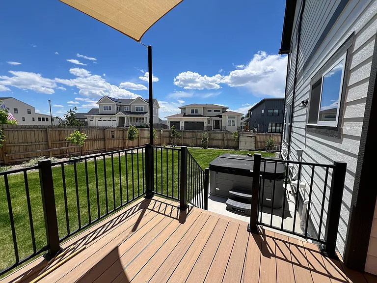 Backyard lawn with hot tub