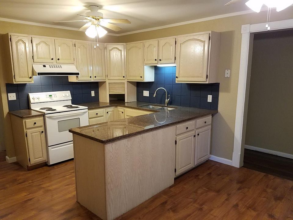 Large kitchen with granite countertops
