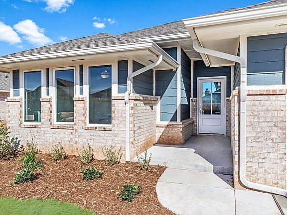 Homes by Taber Kamber B Elevation - 9125 NW 119th
