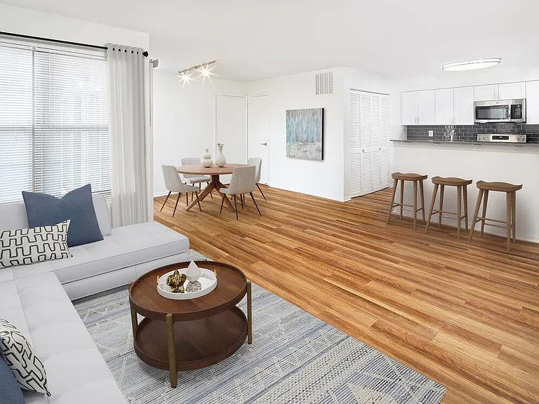 Renovated Package I dining and living room with hard surface flooring