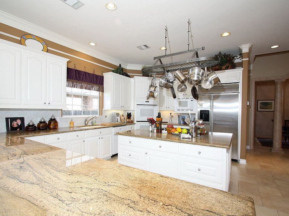 Granite in the kitchen is beautiful including this huge breakfast bar.