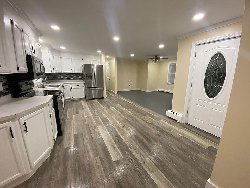 Kitchen opens into living room and front entrance