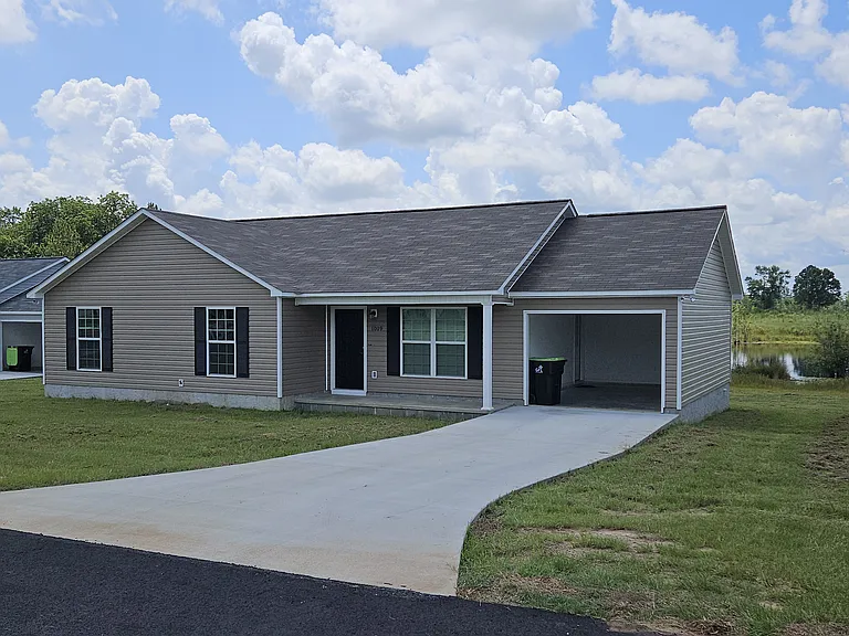 One car port and driveway for two vehicles