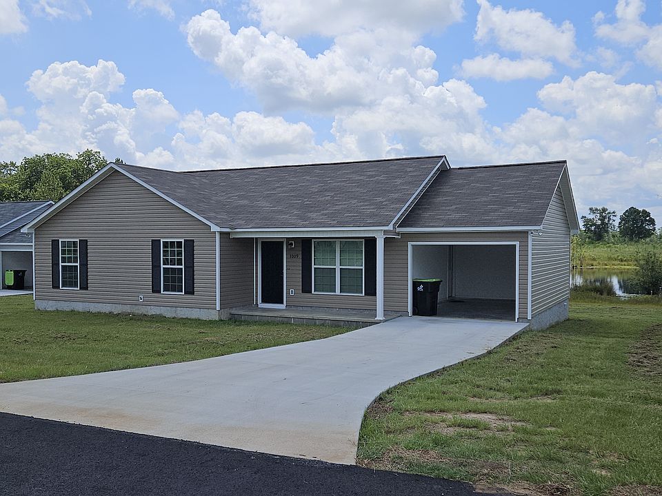 One car port and driveway for two vehicles