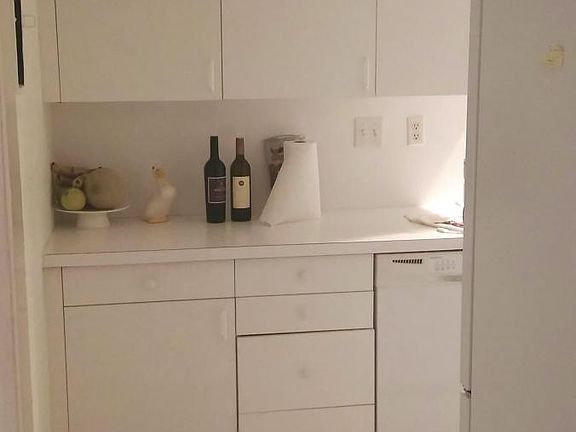 Kitchen view from living room. New LG French-door refrigera