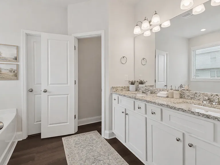 Elegant en suite with a double vanity off the primary bedroom.
