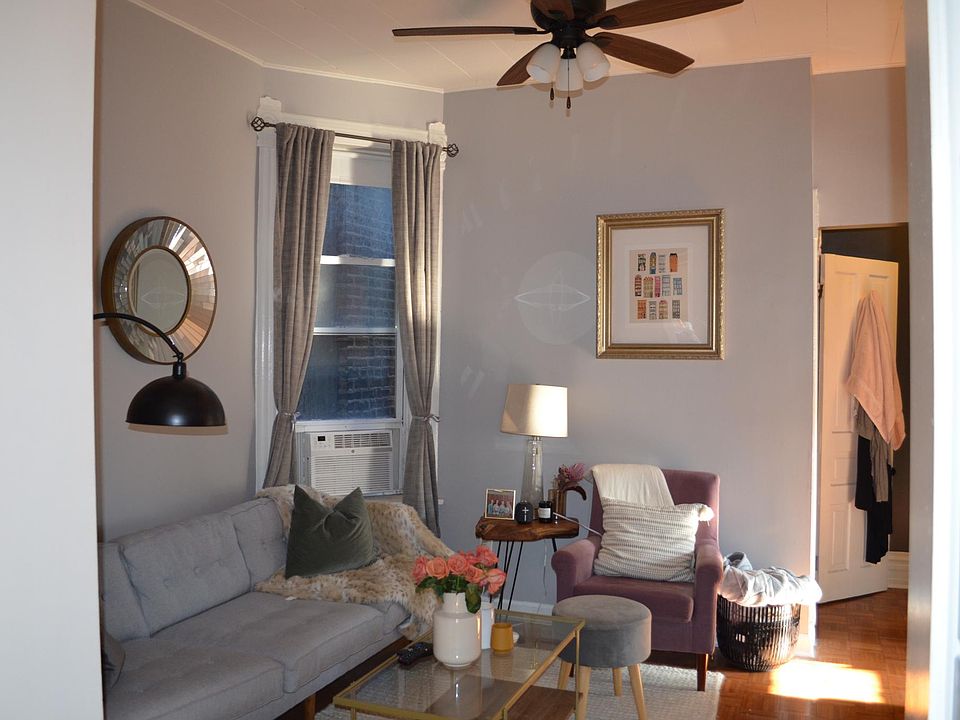 Living room, with previous tenant's furnishings.