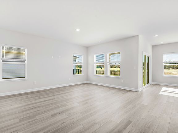 The open-concept living space is accentuated with plenty of natural light.