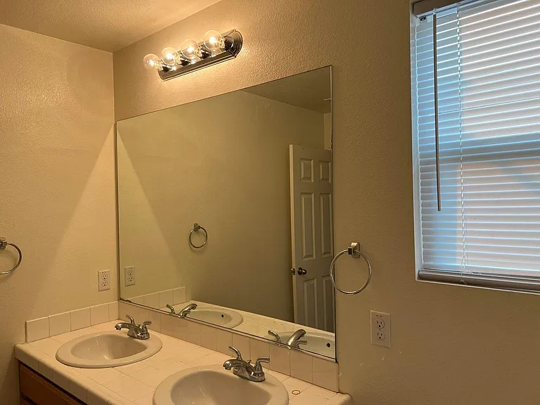 Master Bathroom #2 features a separate shower and bathtub, a vanity mirror, and dual sinks.