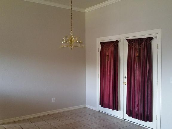 Full dinning Room with double doors that open to patio.