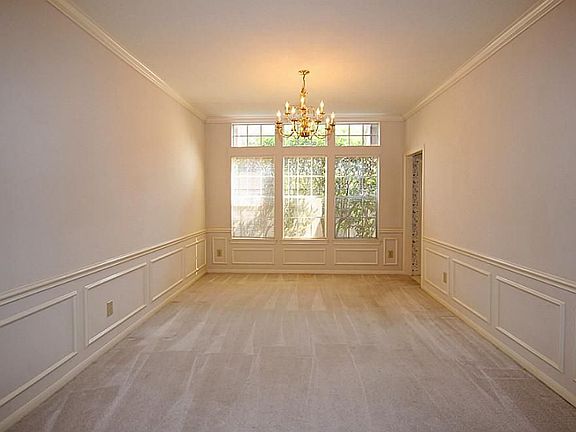 GORGEOUS DINING ADORNED WITH CROWN AND  CHAIR MOLDING
