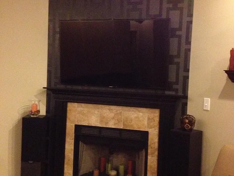 Custom paint job on fireplace wall. Pre-wired for TV mount