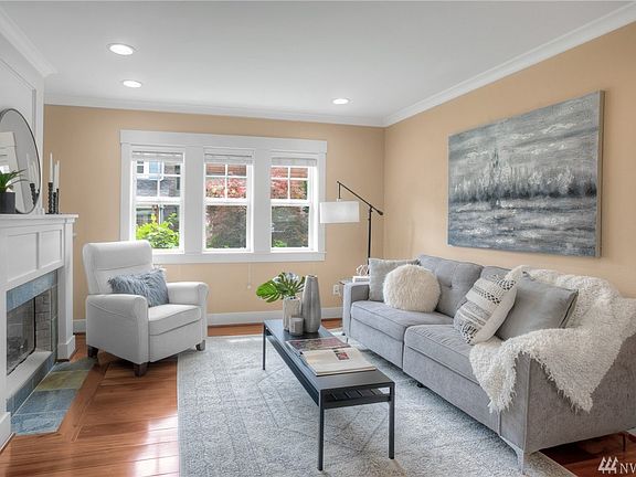 Light filled living room with a gas fireplace