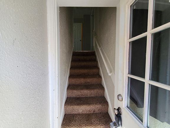 SIDE DOOR VIEW GOING UPSTAIRS TO THE UNIT